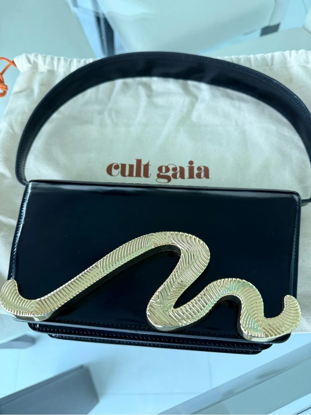 Cult Gaia Black Patent Shoulder Bag with Gold Snake Accent